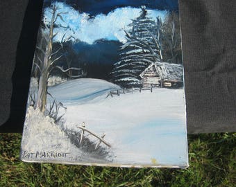 Snowy cabin in the woods