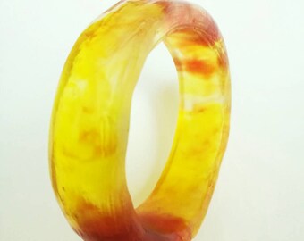 Lucite Cuff Bangle. Transparent jelly red, yellow and orange cuff bangle from the 1980s