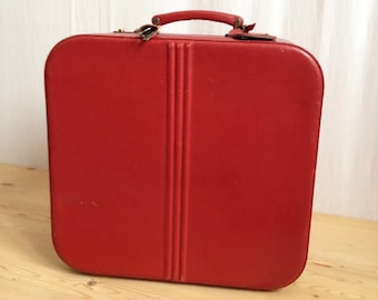 50 year old classic red suitcase