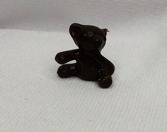 small dark brown teddy bear