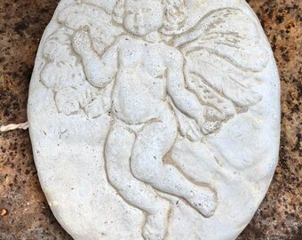 Charming cement angel to enhance your garden or home