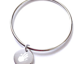 Bangle is engraved with a print