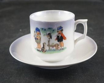 Vintage Child's Porcelain Tea Cup and Saucer GERMANY Girls with Cat and Bird
