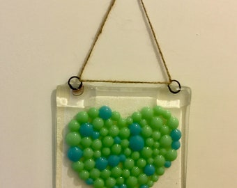 Fused glass heart hanging decoration.