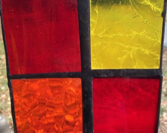 red, yellow and orange stained glass squares
