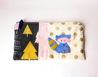 Zipper Pouch, 5.25x9.5" in cream, gold, mustard, pink and blue print fabric with Handmade Felt Raccoon Embellishment, Raccoon Zipper Pouch