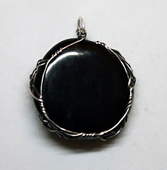 Jet pendant wrapped Celtic style with sterling silver