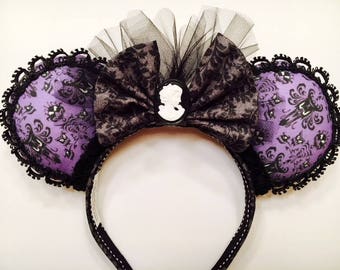 Disney's Haunted Mansion wallpaper Minnie Mouse ears.
