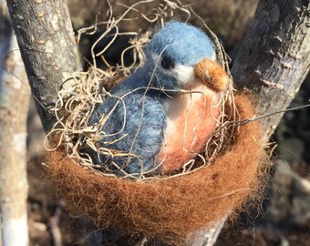 Hand made needle felted bird in a nest