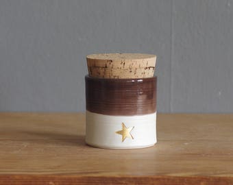 ready made urn or jar. white porcelain clay pottery urn, pet urn or use as a jar. with brown glaze and star shaped stamp in gold