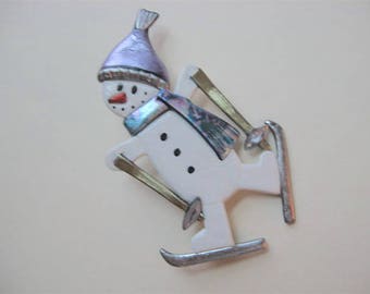 Skiing snowman with lavender hat and scarf scarf brooch