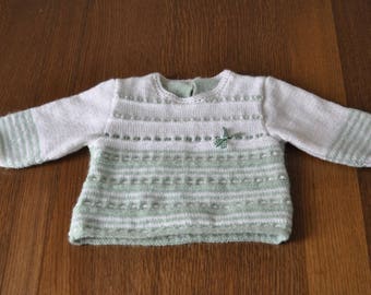 White and pale green sweater