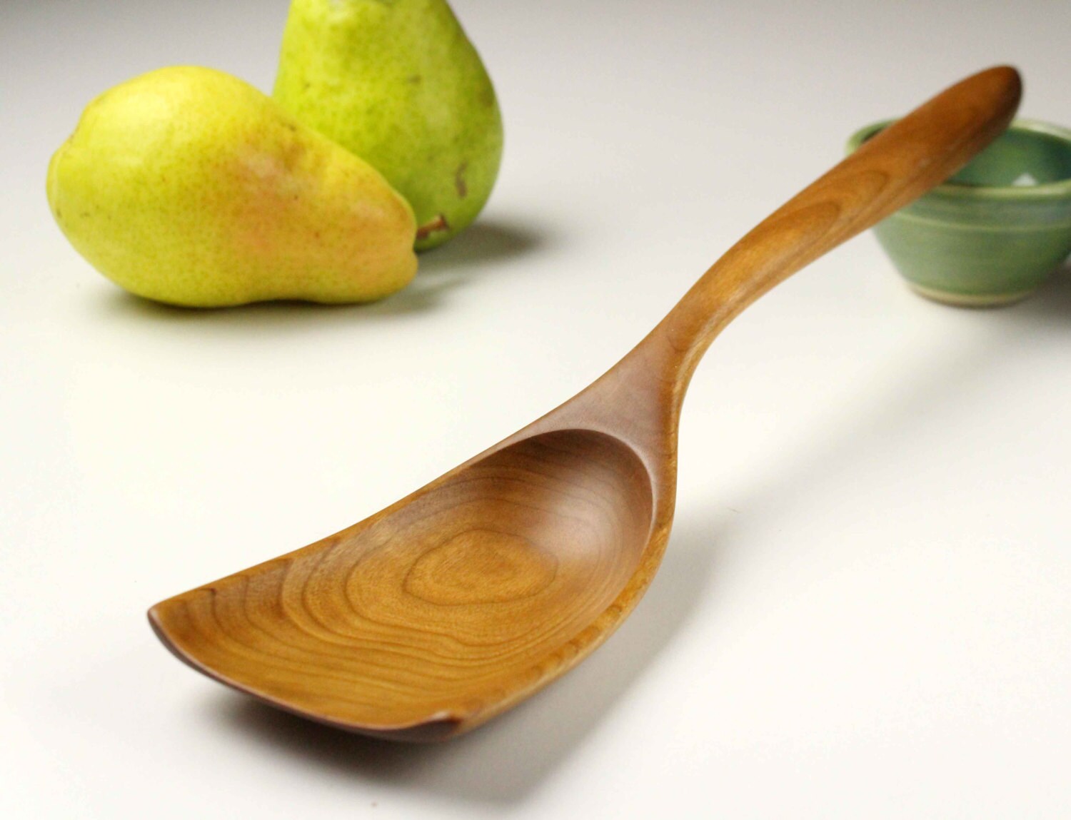 Handmade wooden scoop spoon for serving things like home fries
