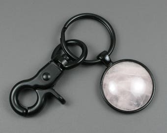 Rose quartz stone keychain in a black bezel setting with an optional swivel lobster claw