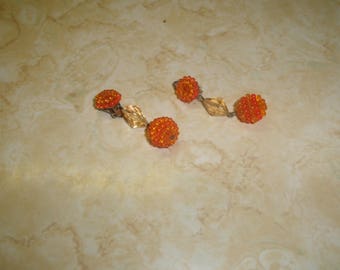 vintage clip on earrings orange lucite bead cluster dangles