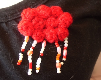 crocheted red and rainy cloud brooch