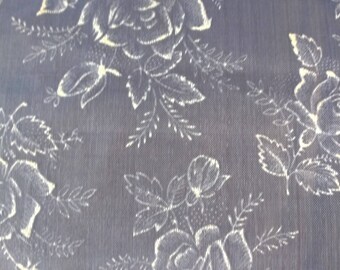 Piece of vintage white organdy fabric embroidered flowers