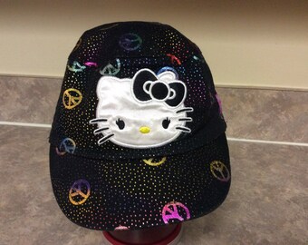 Magnificent Hello Kitty Ball Cap With a Variety Of Metallic Colors Peace Signs All Over The Cap, Sanrio.