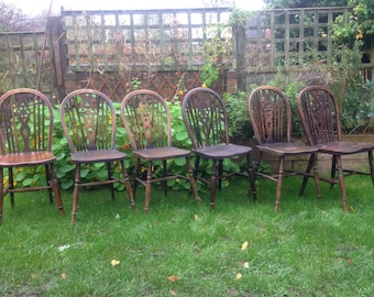 Sold Six wheel back kitchen dining chairs