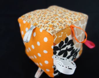 Baby Orange patterns play cube various ribbons galore - baby 3 months