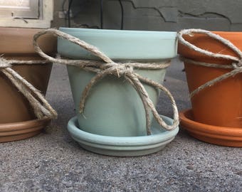 Three hand painted clay pots. Fall colors.