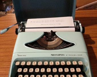 1970's aqua blue Remington Streamline portable typewriter