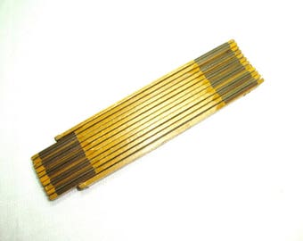 Royal Eagle Folding Ruler. No X-672 has a brass 6" extender. Made in USA. 72" jointed folding rule. in good used condition