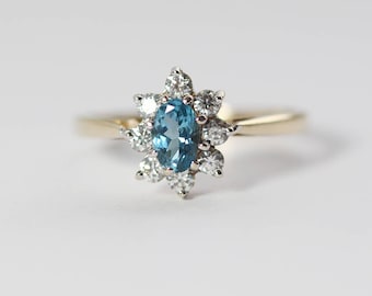 9ct Gold CZ Clear and Blue Cluster Ladies Ring with Oval Shape UK P and US 7.75