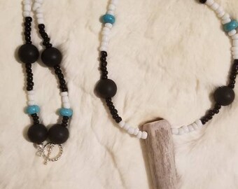 Glass bead and antler tine necklace.