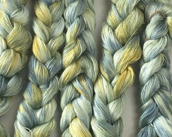 Hand-dyed, pre-wound, 8/2 Tencel weaving warp, 200 ends, 8 yards, in shades of blue, yellow, and pale green -109