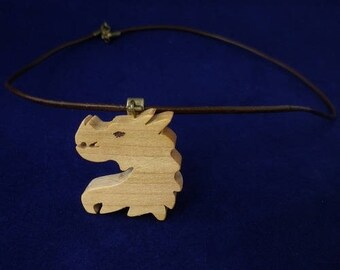 dragon in cherry wood and brown leather pendant