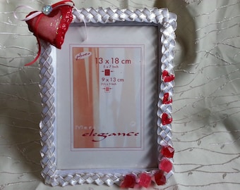 Day of St. Valentina.Serdechny gift for lovers. Heart with love. Frame for photo lovers or family ph.