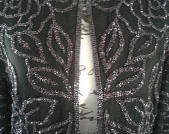 Sequined formal jacket....black with purple sequins......fully lined.....excellent condition...Creative creations.....Silk