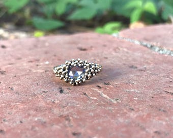 A one of a kind, hand crafted color-changing rose cut sapphire ring. Size 5.5 Sterling Silver
