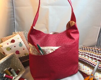 Pink faux ostrich leather handbag