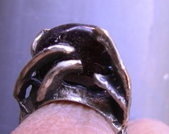 cast silver ring, dark red garnet