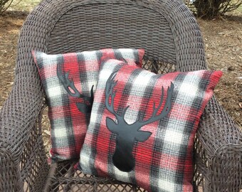 Red and gray plaid pillow with deer