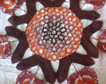 round centered crocheted stylized flowers