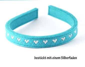 Headband made of wool felt embroidered with a shiny silver thread