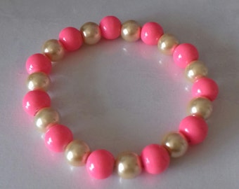Pink and gold stretch bead bracelet