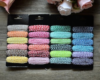 6 7.5 m sprockets of baker's twine cotton thread.