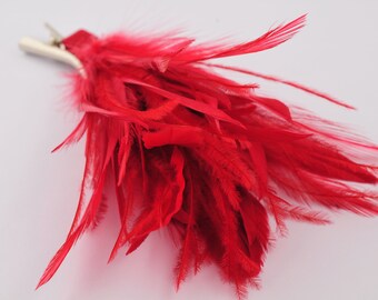 Trimmed with red feathers hair clip