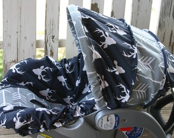 navy blue with white buck marks and gray with white arrows infant car seat cover and hood cover