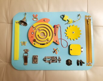 Busy Board. Activity board, early development Montessori educational toy.