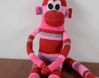 Pink, red and silver stripped monkey, sock monkey, pink monkey
