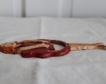 Cast iron bottle opener handheld circa 1930s