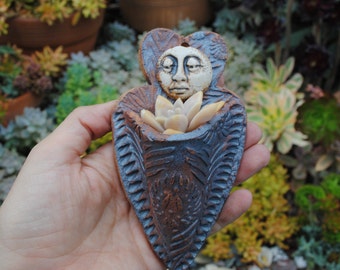ceramic wall planter figurative garden art sculptural plant holder
