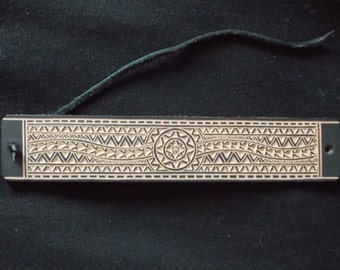 Carved leather bracelet