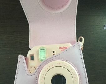 Instax polaroid light pink camera