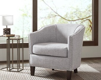 Designed for stylish comfort and the efficiency to best utilize space, this shaped barrel armchair maximizes sitting space for any room.